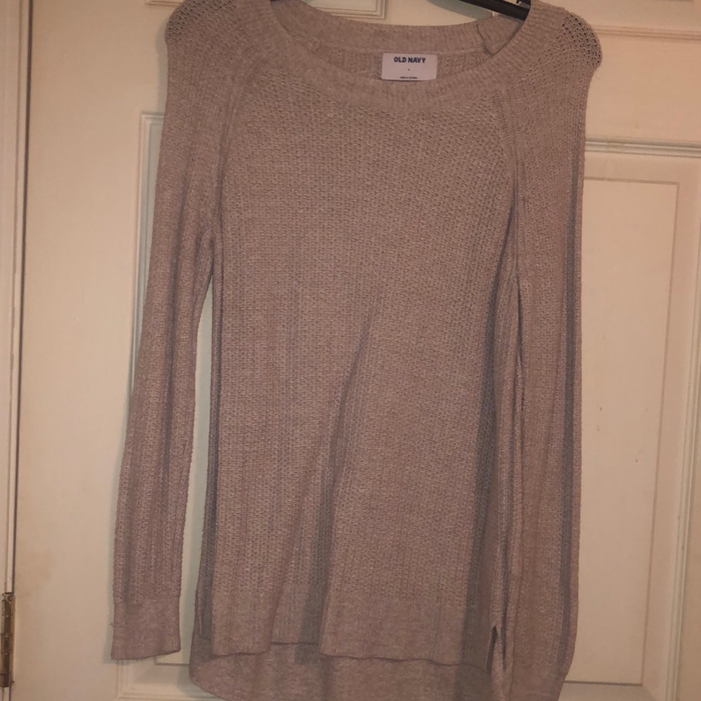 Woman’s cream colored sweater size S, fits up to a size large